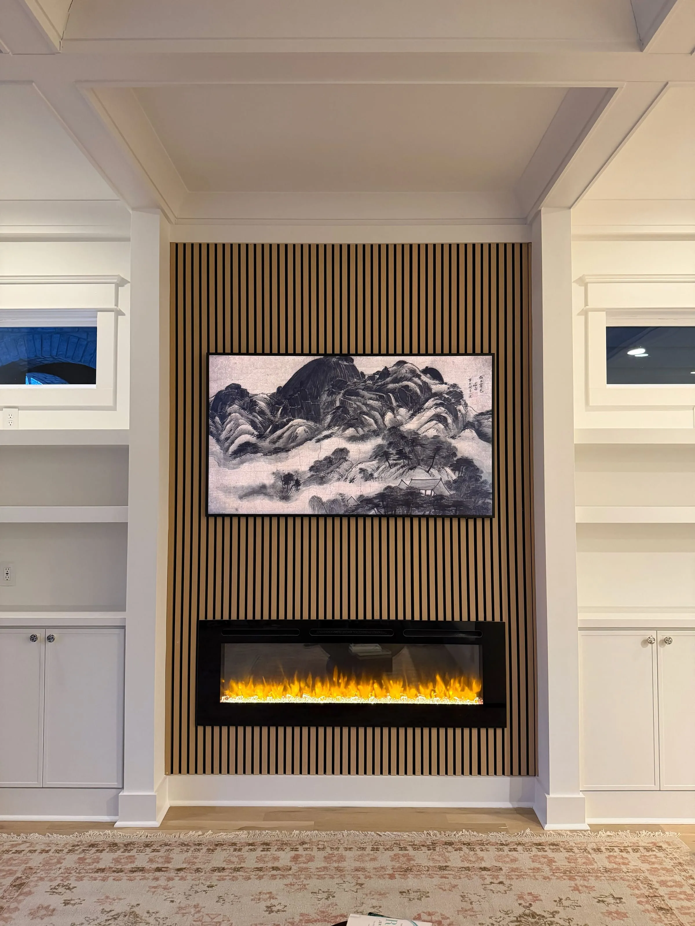 Built-in shelving and fireplace as unified composition